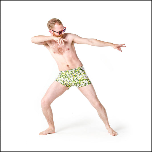 Daisy Shorts, a handmade-to-order piece in daisy print spandex. These  unisex shorts are both stylish and sustainable and feature a high elasticated waist and full length white side panels.