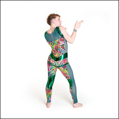 Mardi Gras Catsuit, a handmade-to-order piece in green and neon pink mardi gras printed spandex. This statement catsuit is both stylish and sustainable. The reversible design features a v-shaped front neck and a square mesh back neck (for the style reversed see the Neon Tartan Catsuit). It includes green mesh side panels and multiple green foil shine contrast panels. 