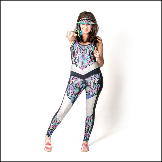 Lacerta Catsuit, a handmade-to-order piece in rainbow snakeskin printed spandex. This funky racer back catsuit is both stylish and sustainable. The multi panel design features a round neck, black hologram inserts and silver liquid foil neck, waist and knee panels. 