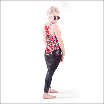 Poker Leotard, a handmade-to-order piece in poker print spandex. This flattering leotard is both stylish and sustainable. The deep v-neck design features a black mesh insert and full length side panels.