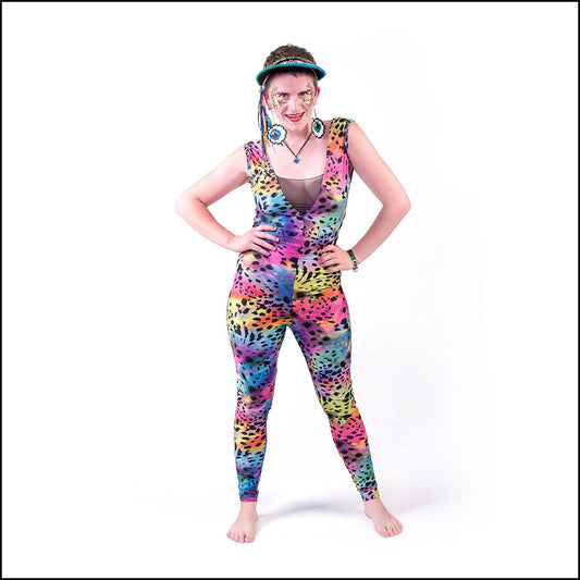 Techno Leopard Catsuit, a handmade-to-order piece in mystical rainbow snowcat printed spandex. This statement catsuit is both stylish and sustainable. The unisex design features a flattering V-neck with a black mesh insert and curved black mesh side panels that hug your curves in all the right places.