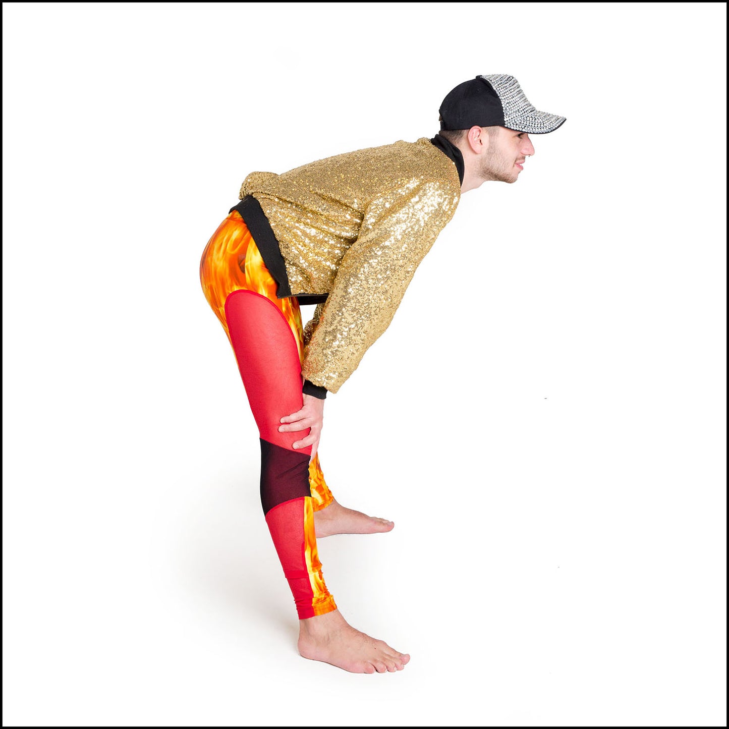 Blaze Leggings, a handmade-to-order piece in orange flame printed spandex. These scorching leggings are both stylish and sustainable. The unisex design features a high elasticated waistband and black over red mesh knee and red mesh side panels.